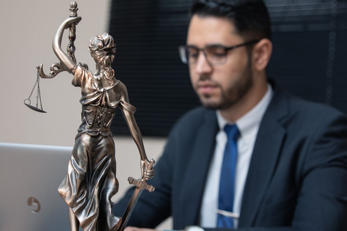Attorney reviewing case files at his desk
